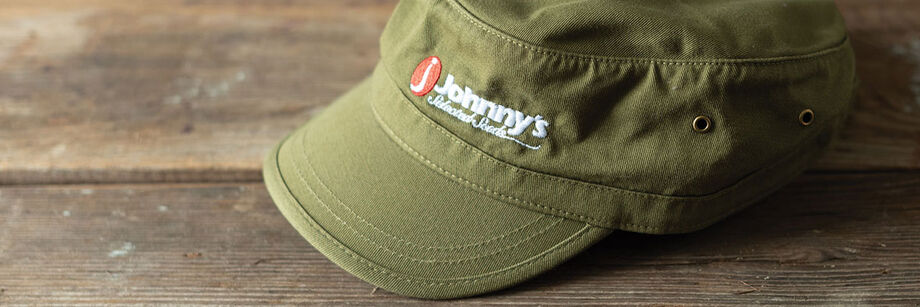 White and green Johnny's Selected Seeds baseball caps.