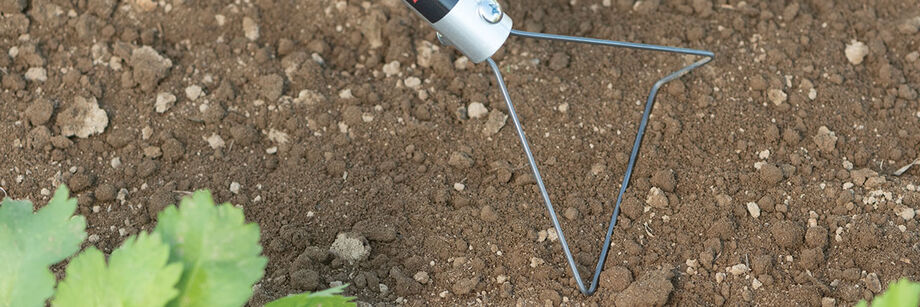 Close up of a wire hoe.