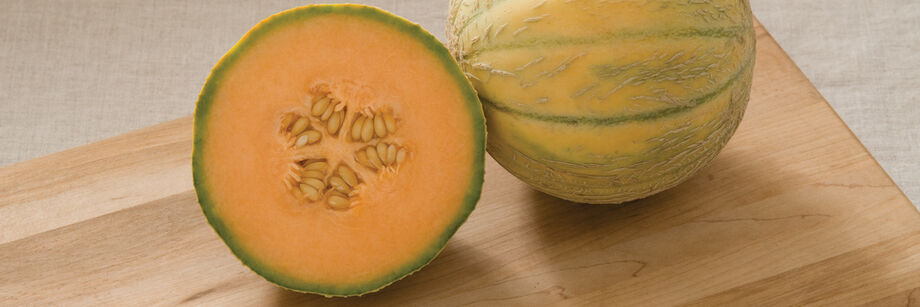 Charentais type melon, cut open to reveal the orange flesh.