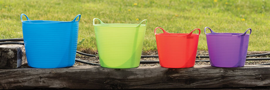 Four Gorilla Tubs (formerly Tubtrugs) in different colors and sizes.