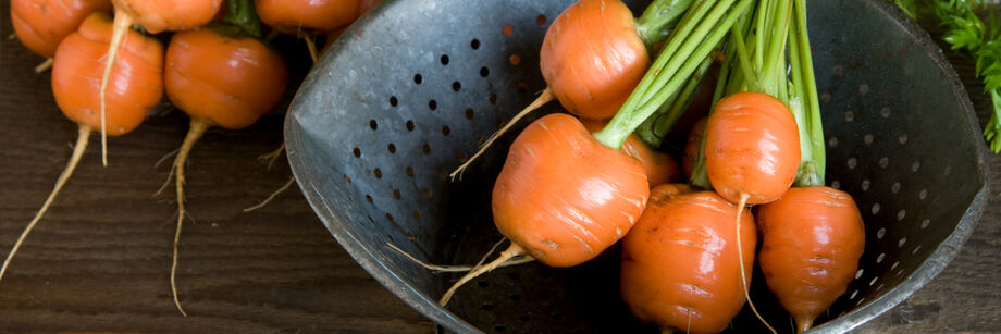 Atlas carrots in a metal colander.