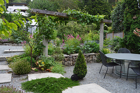 Lorene's patio garden combines flowers with edible crops.