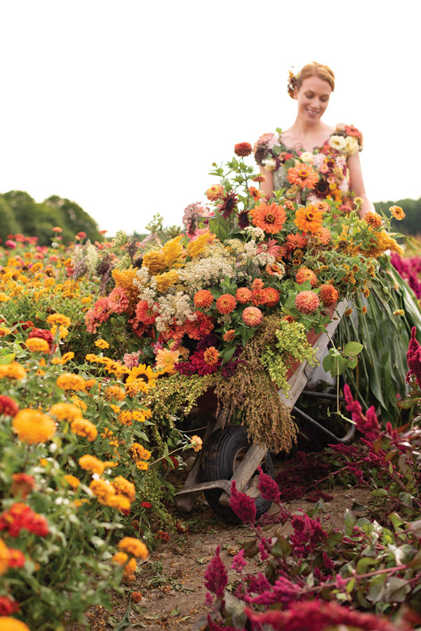 Floral Designer Rayne Grace Hoke at work on the gown