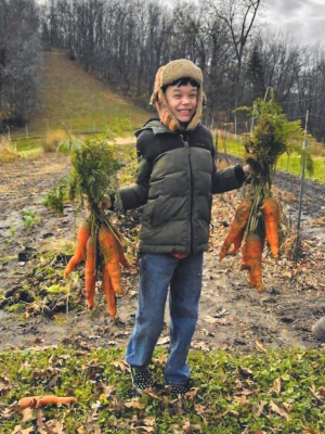 Boy holding carrots
