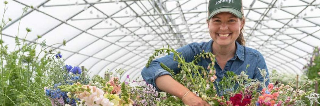 Flower Trialing Tech Joy Longfellow in her overwintering tunnel, spring 2020