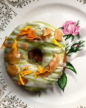 Donut with marigold petals on it