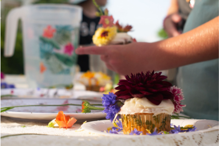 dahlia flower topping a cupcake